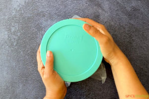 Covering a bowl with a green airtight lid