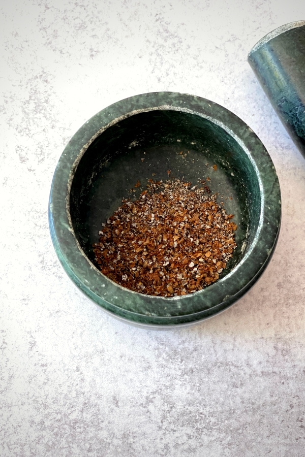 crushed cardamom seeds in mortar