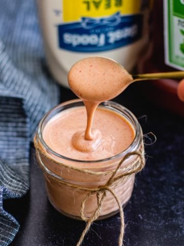 easy french fry dipping sauce in glass jar with spoon and mayo in background