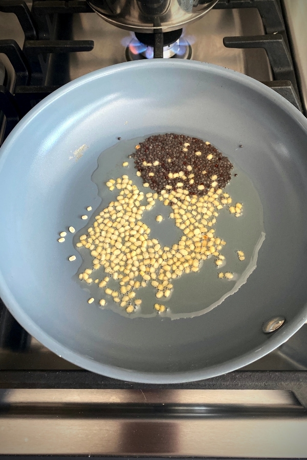black mustard seeds and split lentils in oil in nonstick skillet