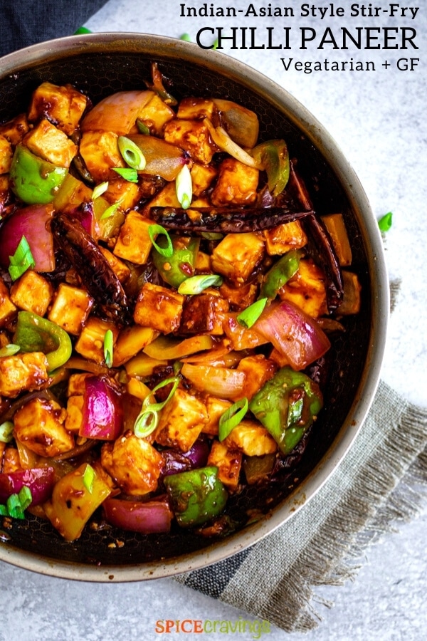 paneer cubes and vegetables in Indo-Chinese sauce in stainless steel skillet