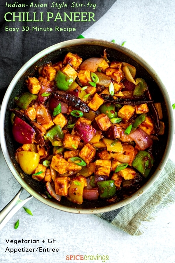 paneer cubes and vegetables in Indo-Chinese sauce in stainless steel skillet
