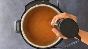 Pureeing sauce with hand blender