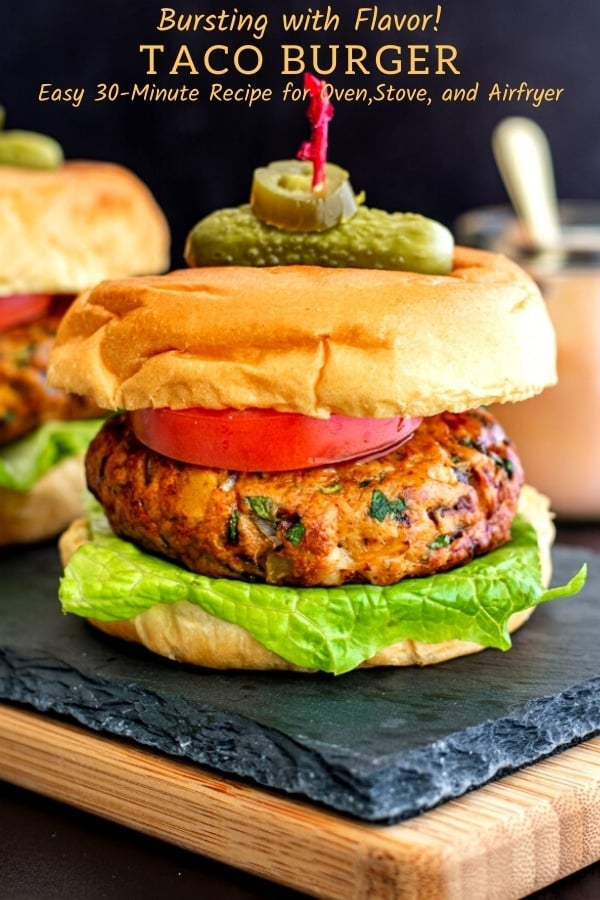 mexican chicken burger on buns with lettuce, tomato and skewered with pickle
