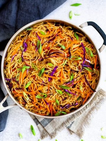 vegetable chow mein recipe in chef pan with towel
