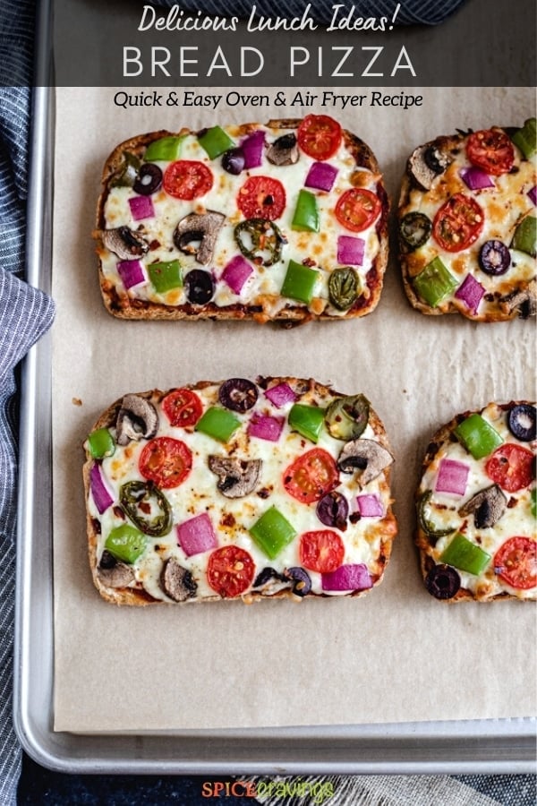 pizza toast recipe with fresh vegetables on parchment-lined baking sheet