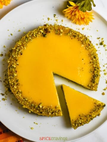 Mango cheesecake with pistachio crumbles on top