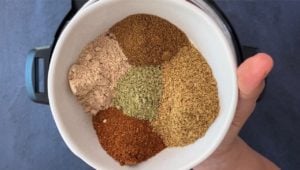 mix of indian spices in white bowl