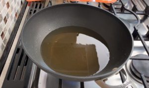 two inches oil in wok on stove