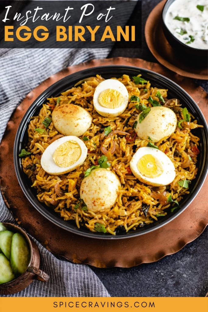 spicy eggs and rice in black bowl