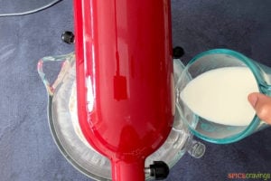 pouring milk into stand mixer
