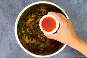 soaked saffron in small white bowl over instant pot