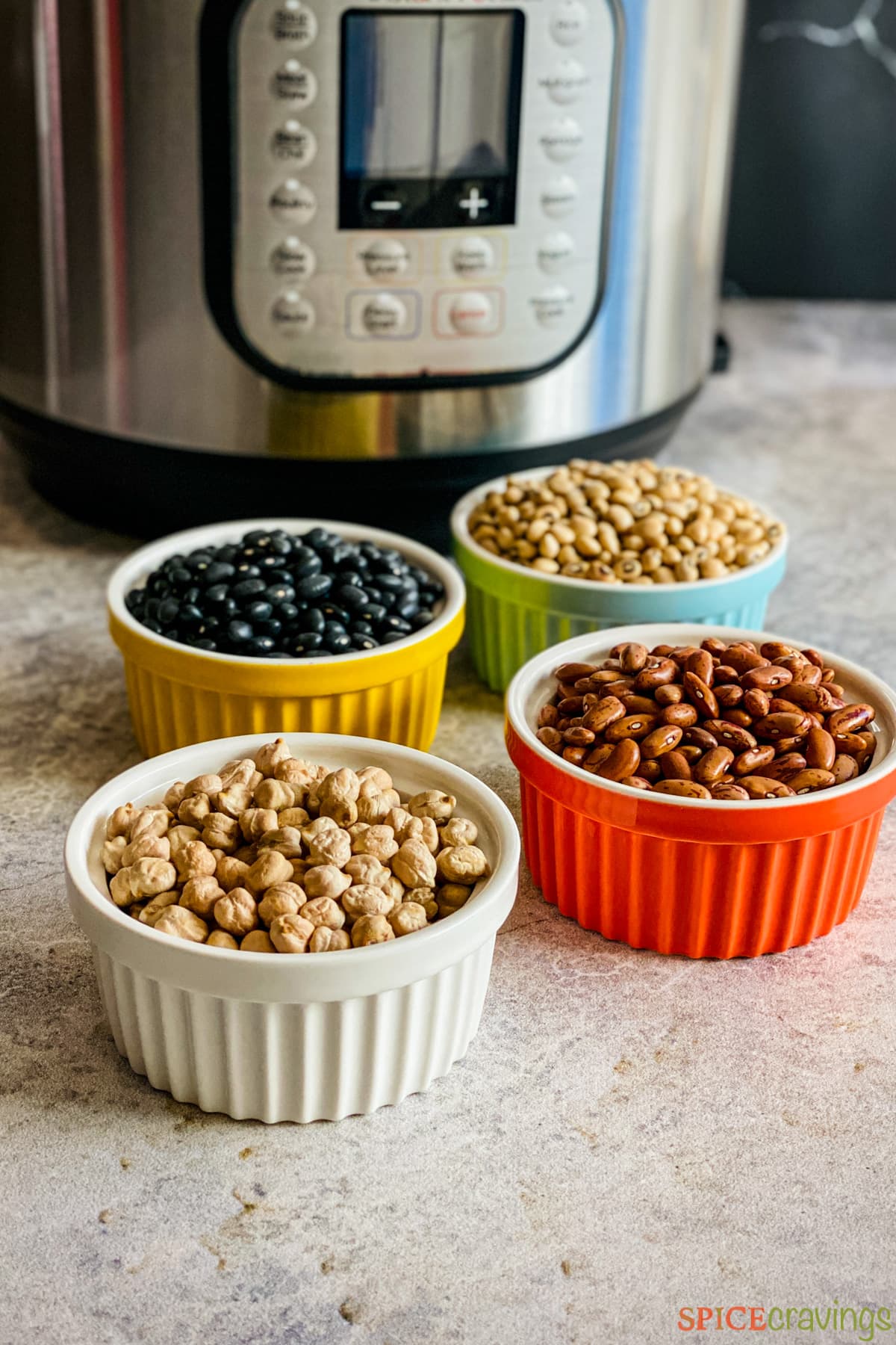 4 bowls of dried beans next to an Instant Pot
