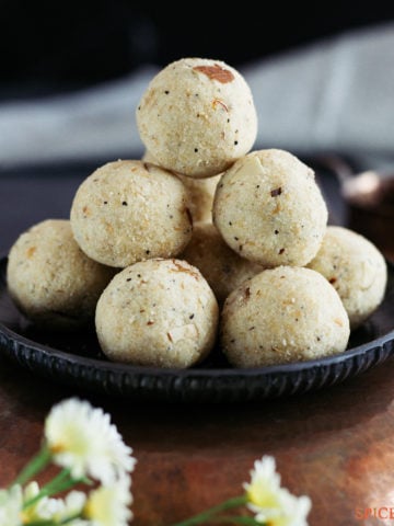 Suji ladoo stacked on a metal plate