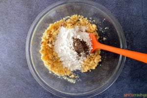 Powder sugar and cardamom in bowl with semolina mix