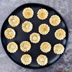 Empty phyllo cups on a round tray
