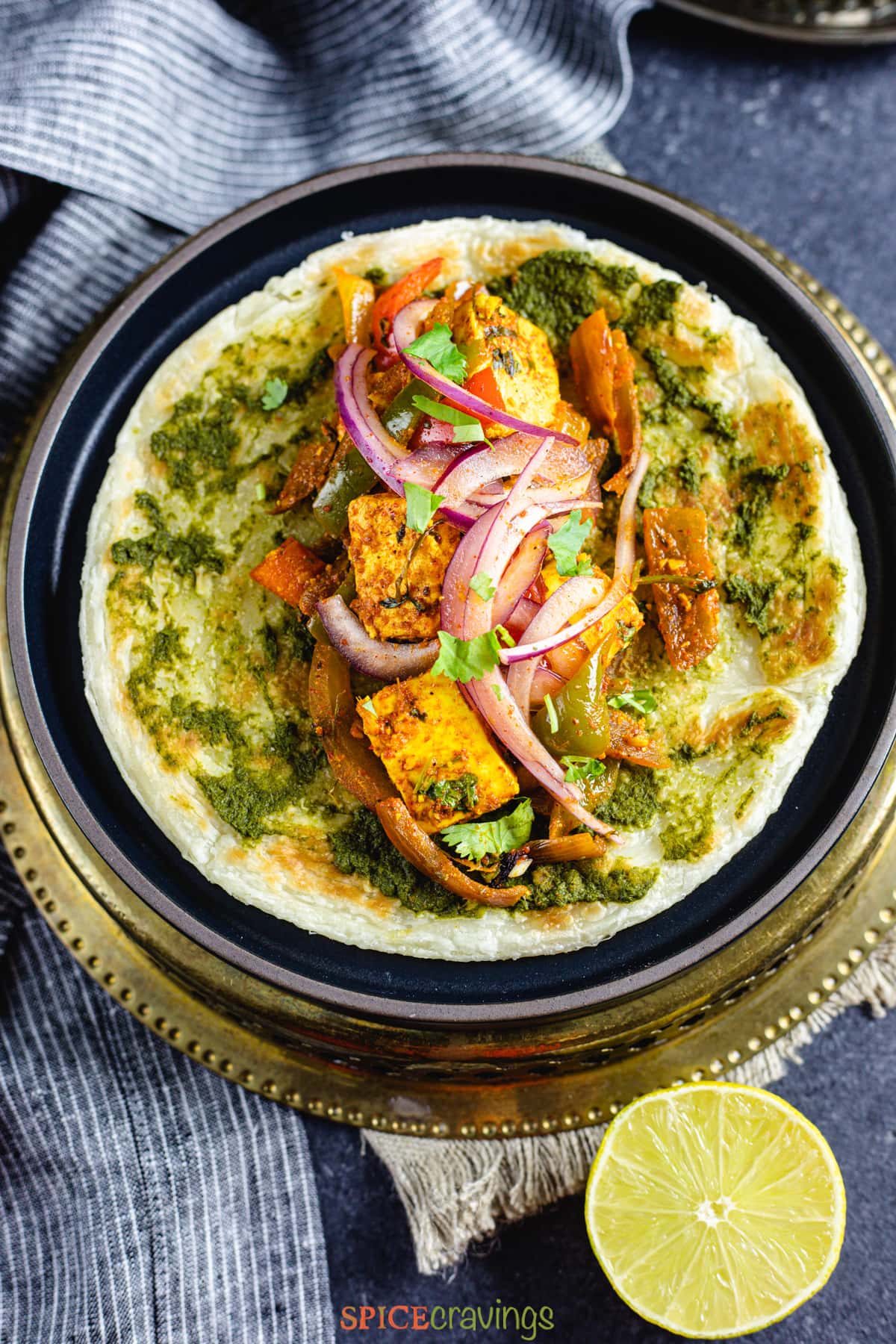 A paratha stuffed with veggies and marinated paneer