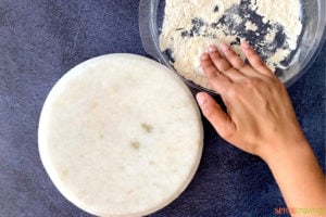 Dusting roti dough in dry flour