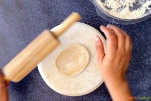 Rolling dough ball into Indian chapati