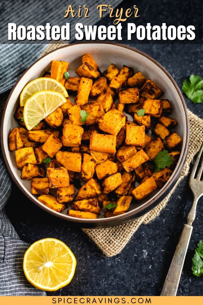 Air Fryer Sweet Potatoes in a bowl with lemon wedges