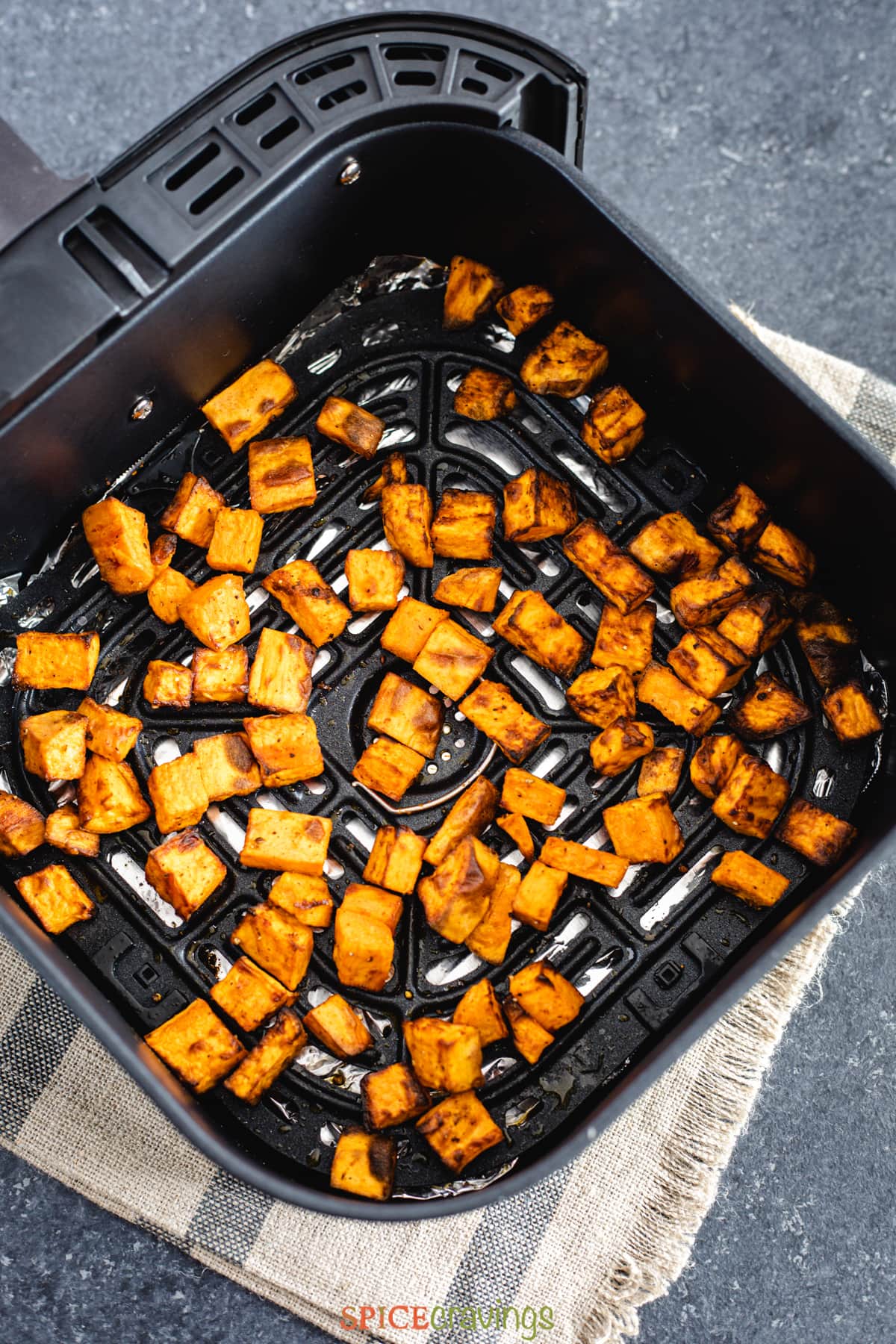 Cubes of roasted sweet potatoes in an air fryer