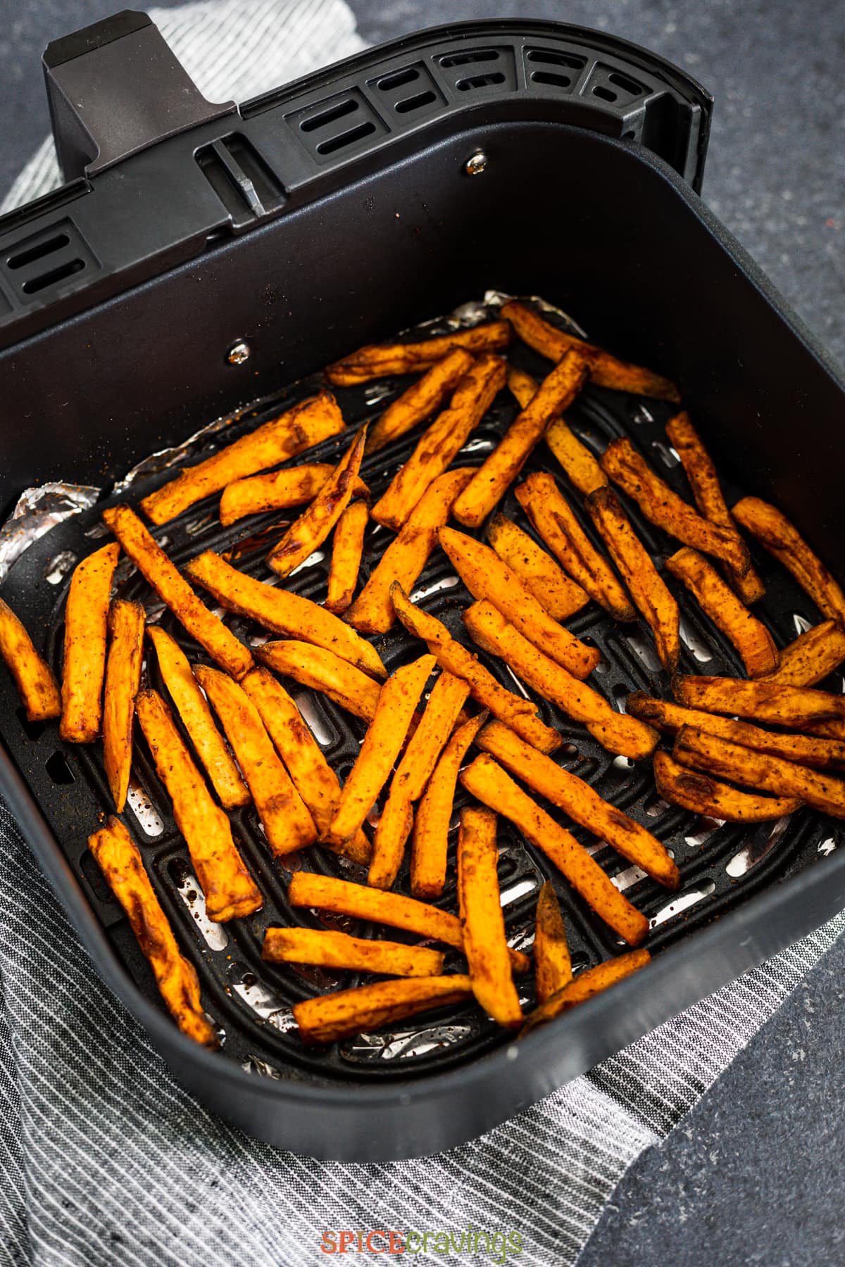 Fries inside an air fryer basket