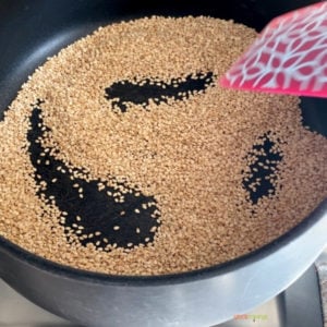 Toasting sesame seeds in a pan
