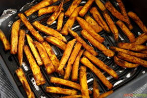 Sweet potato fries in an air fryer basket