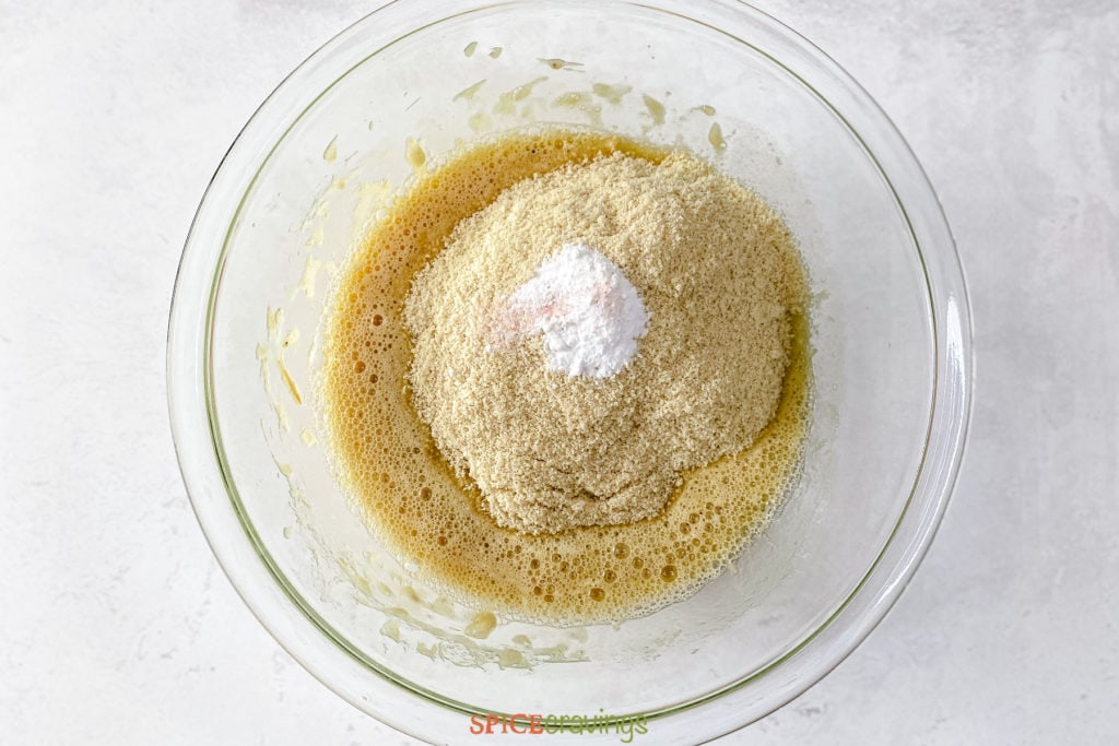 almond flour dry ingredients and banana mixture in glass bowl