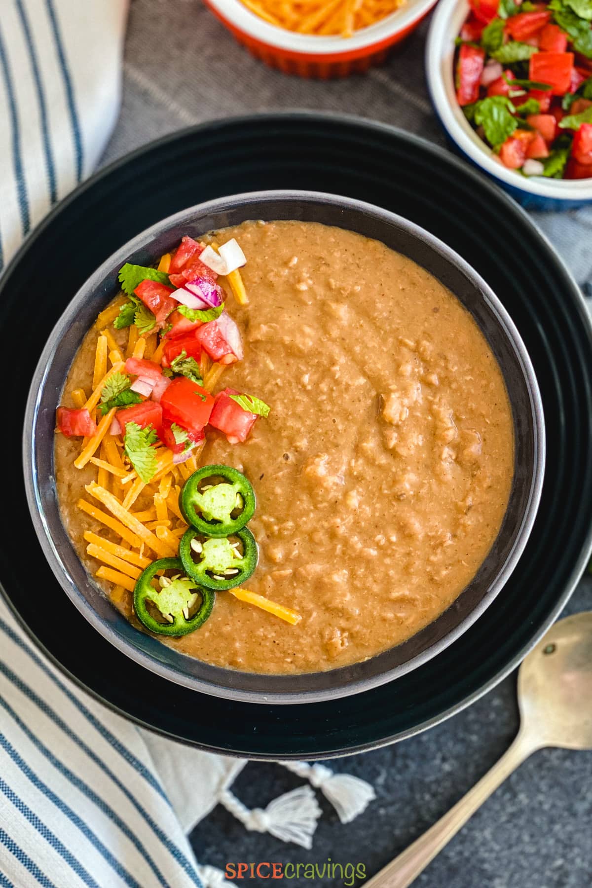 Instant Pot refried beans in a black bowl