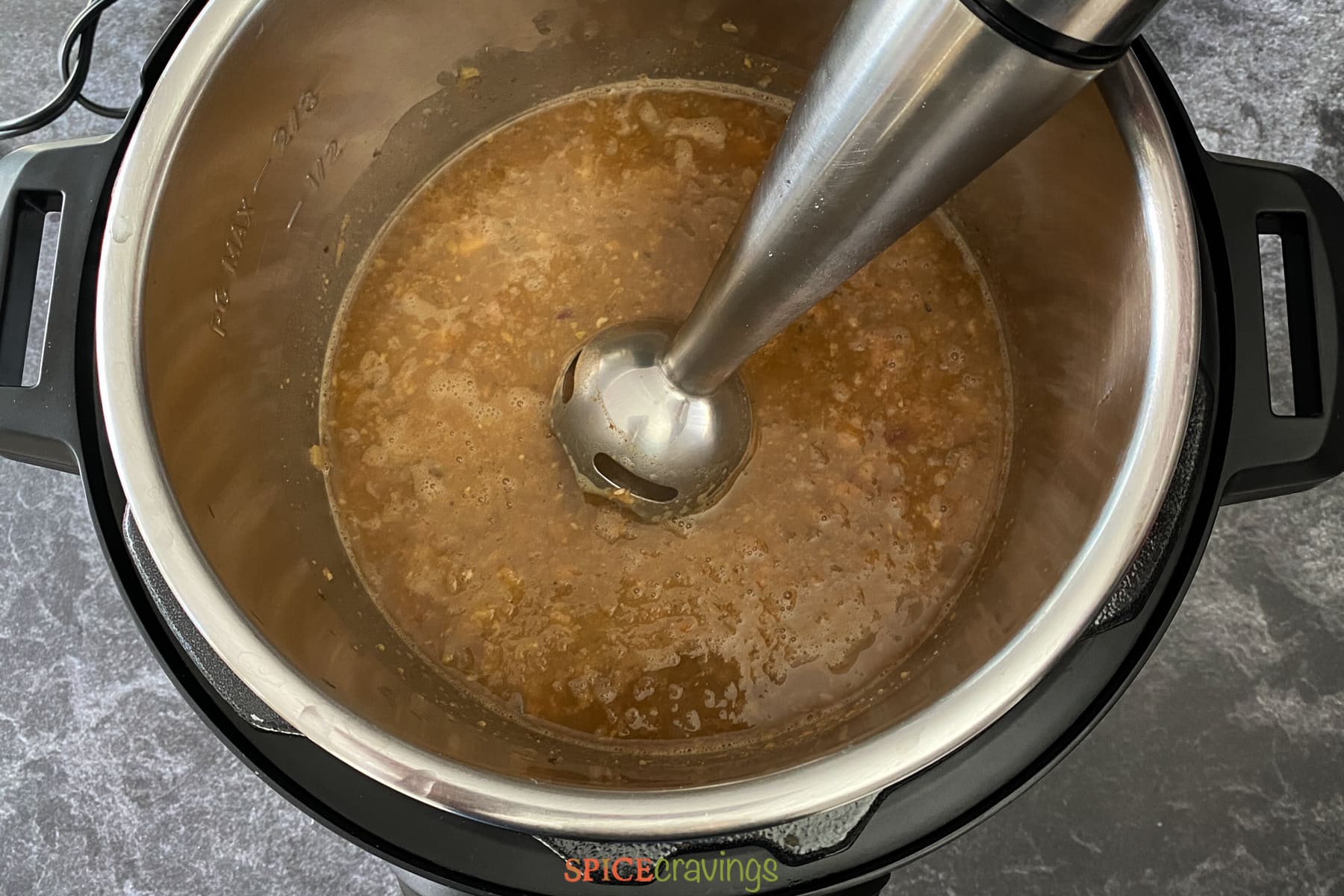 Mashing pinto beans after cooking