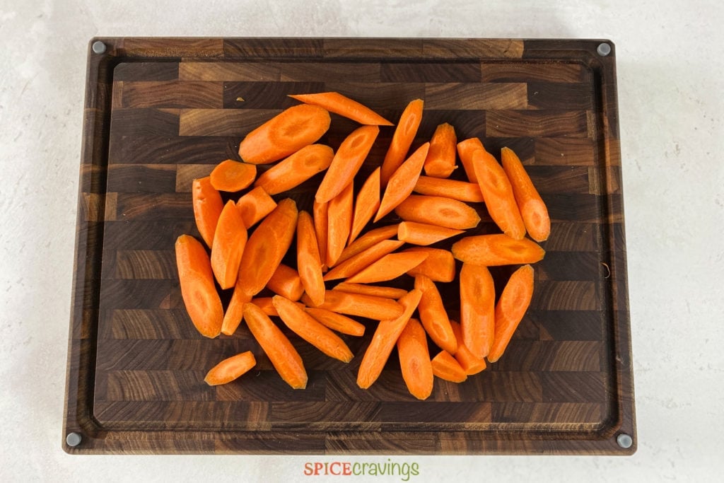 Sliced carrots on wooden cutting board