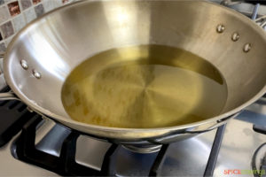 oil in wok on stovetop