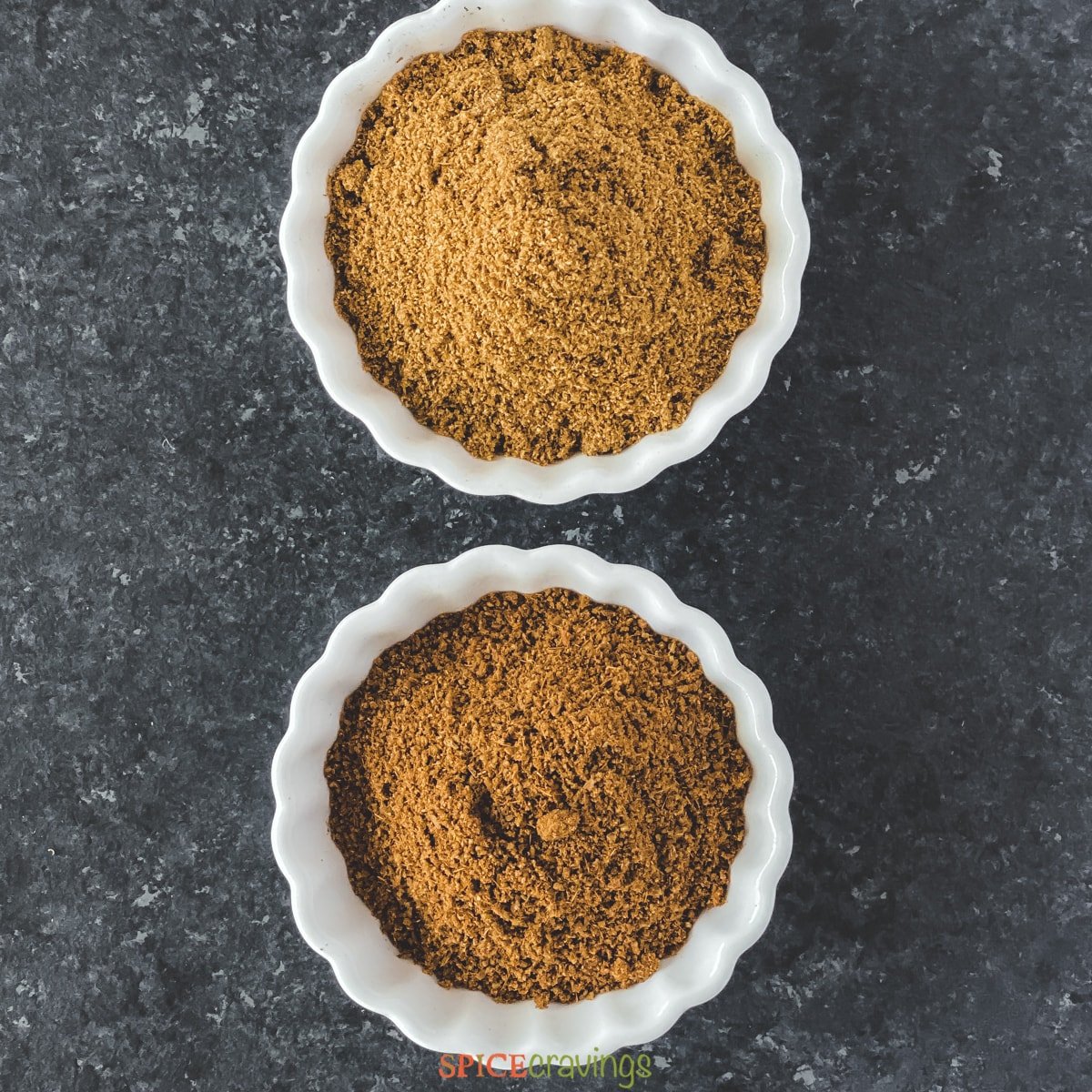 ground cumin and roasted cumin powder in white bowls