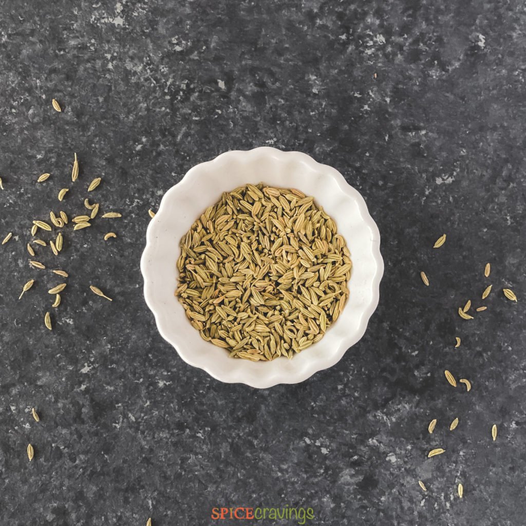 whole fennel seeds in white bowl