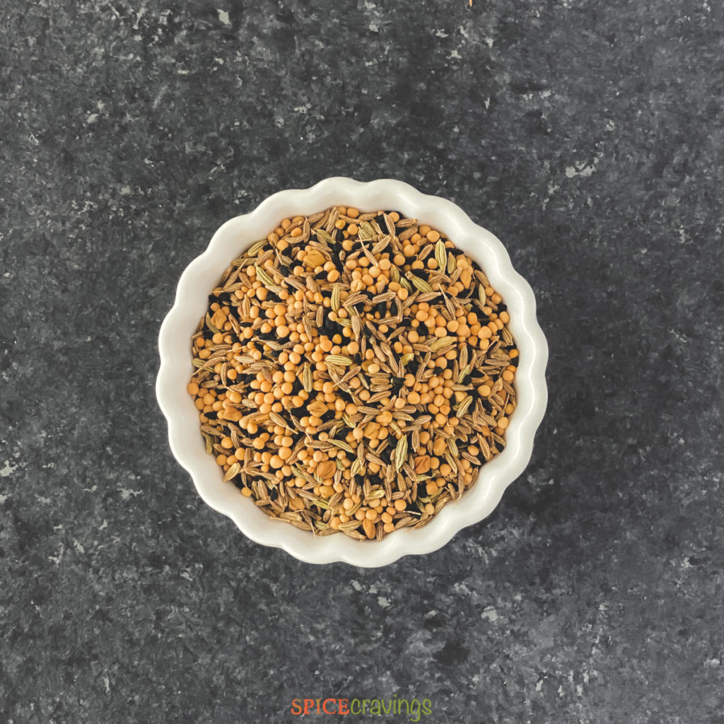 panchporan spice blend in white bowl