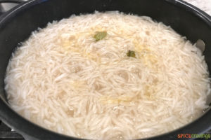 Partially cooking rice in a pot
