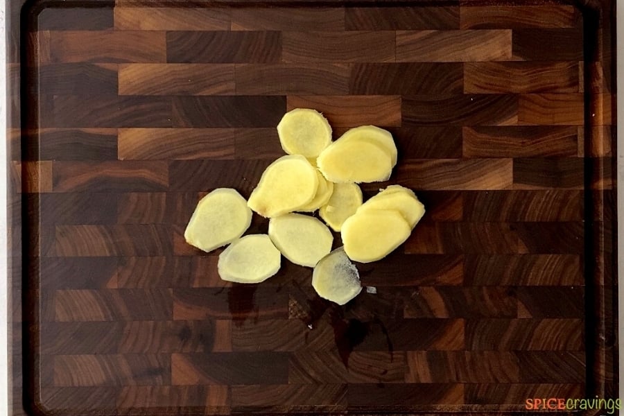 Slices of ginger on a cutting board