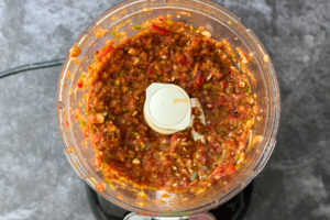 Chunky tomato based sauce in food processor jar