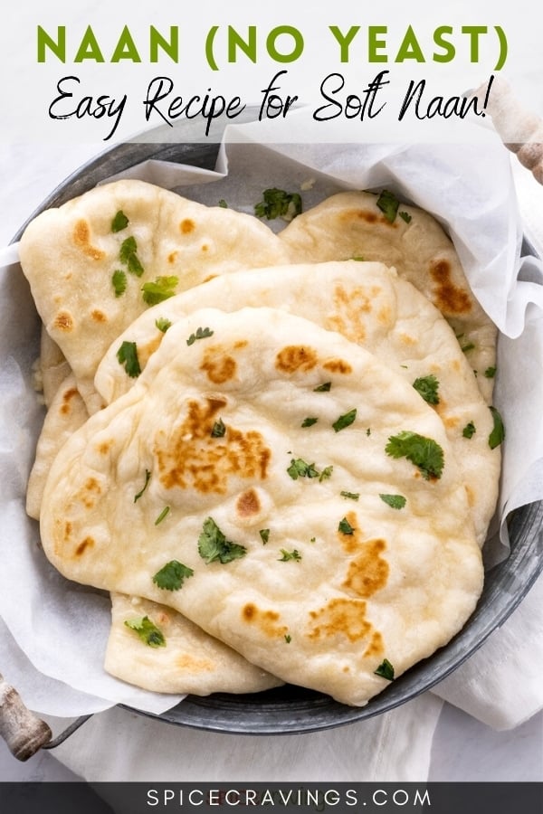 naan bread in bowl with kitchen towel