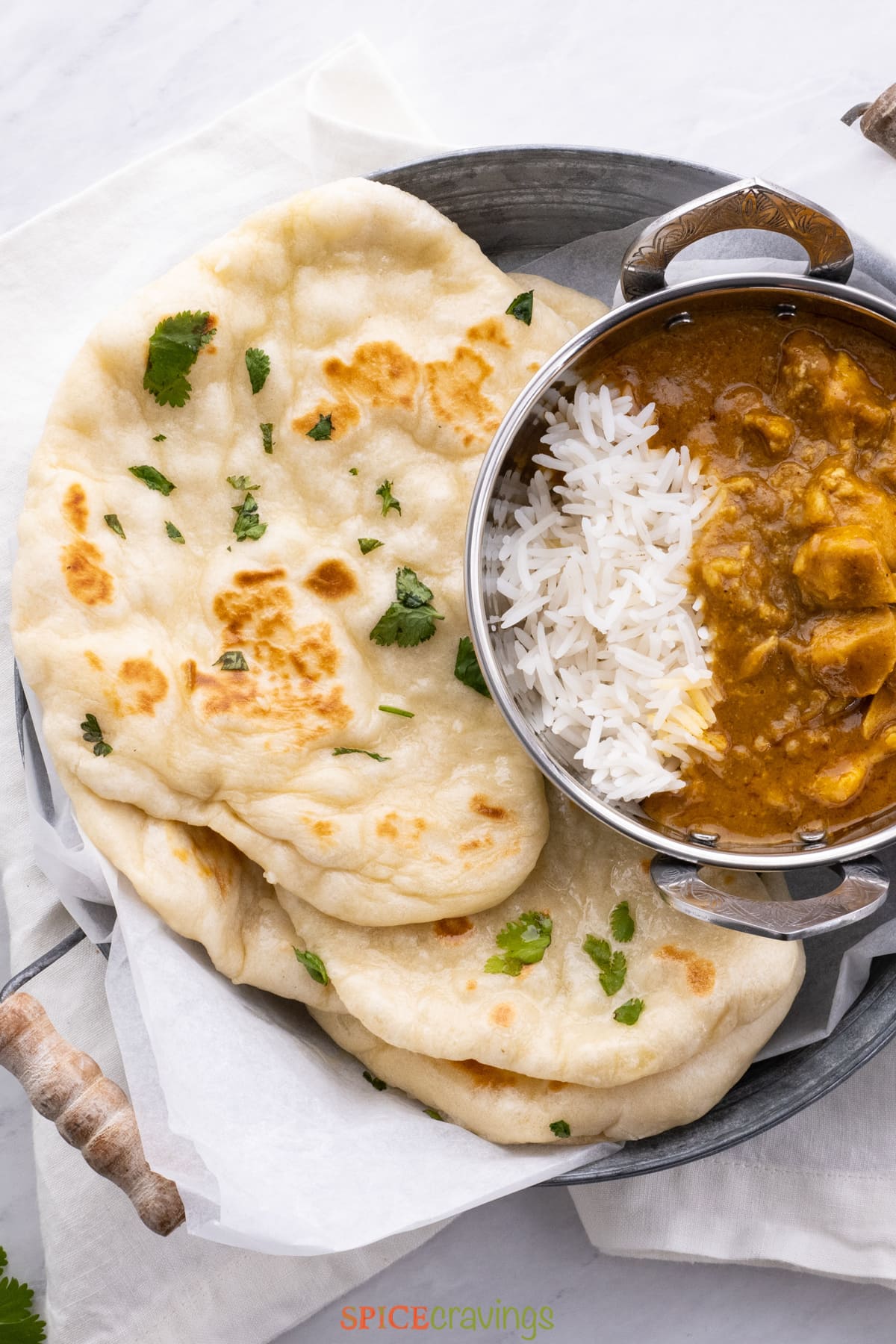 naan bread with rice and curry on side