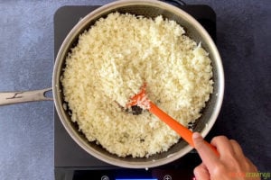 sautéing cauliflower rice in skillet