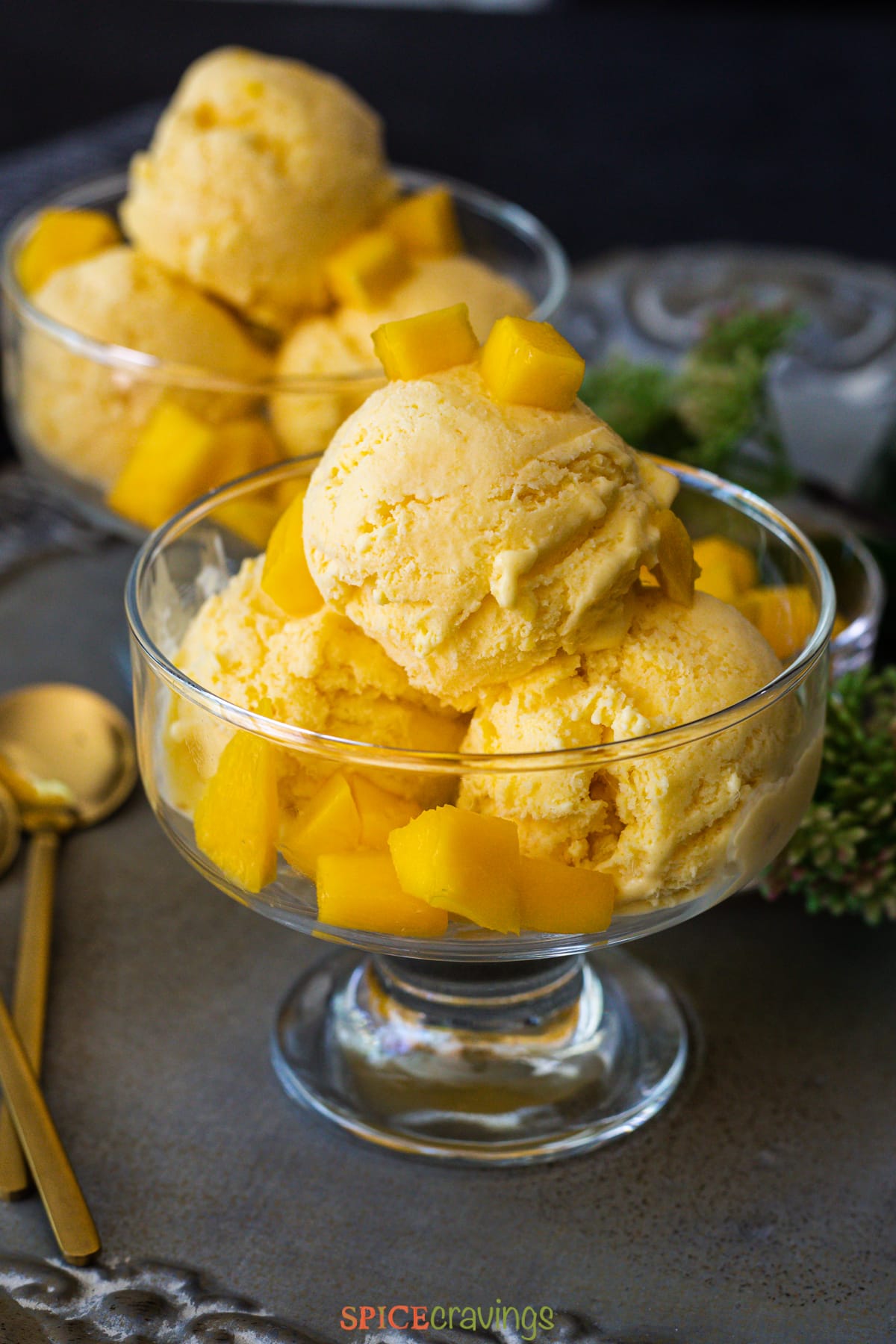 mango ice cream in glass bowl