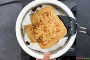 Storing cooked paratha in a lined insulated casserole