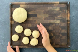 Dividing and Rolling out dough balls for making paratha