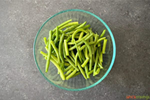 bowl of prepped green beans above