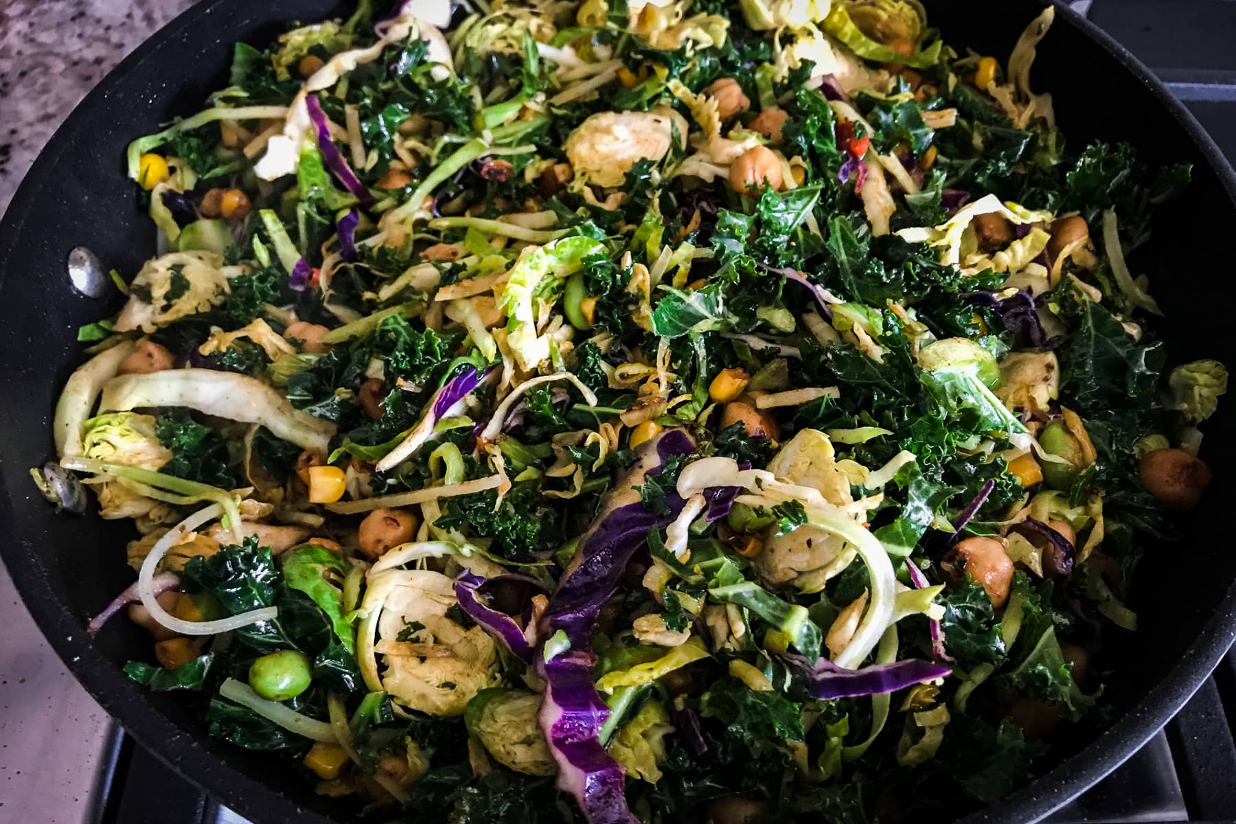 Kale and cabbage salad in a skillet
