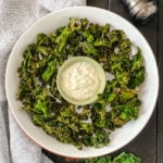 White bowl with kale chips and dip