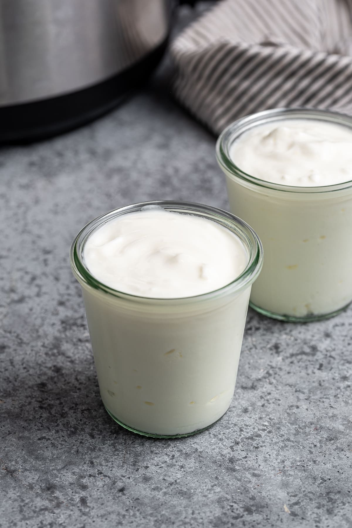 Plain yogurt in two glass jars