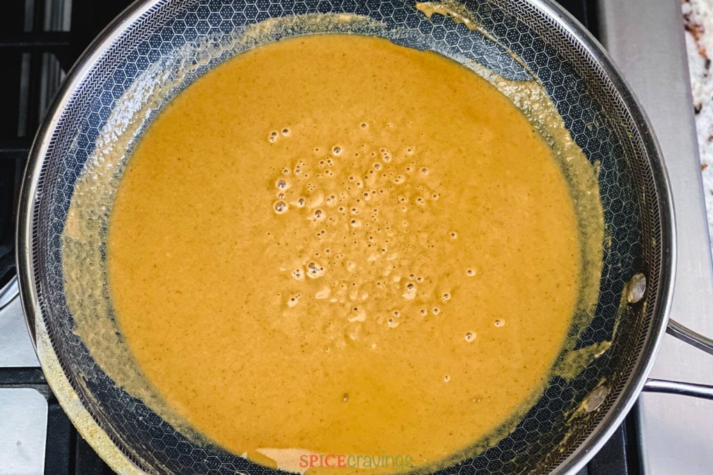 Browning flour with ghee in a pan